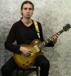 Sitting electric guitar position